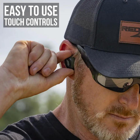Man using Caliber BT Wireless Shooting Ear Protection For Gun Range With Bluetooth Hearing Protection And Electronic Noise Reduction 25 dB NRR Lightweight Ear Buds For Shooters On The Go