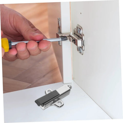 Hand holding screwdriver to install Premium Heavy Duty Soft Close Cabinet Damper For Kitchen Wardrobe Doors.