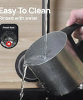 Hand rinsing 4-In-1 Milk Frother And Warmer For Hot Or Iced Lattes Cappuccinos And Macchiatos, Barista-Grade Foam Electric Steamer 12.5oz Stainless Steel Milk Warmer under tap