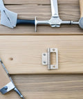 12 Piece Stainless Steel Cabinet Door Hinges Set Quiet Flush Self Closing For Wardrobe And Office Use 51x25x1.2mm displayed on wood