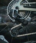 XPLR 13-Speed Cassette 10-46T For Gravel Cycling with beefy steel cogs on a bicycle, showcasing lightweight build and durability.