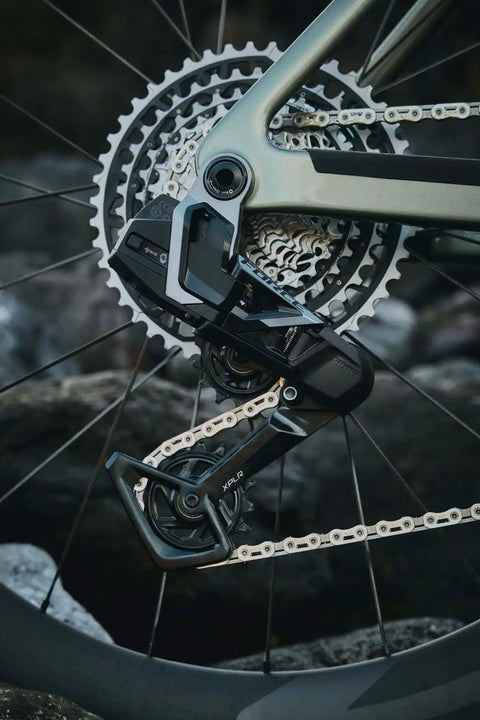 XPLR 13-Speed Cassette 10-46T For Gravel Cycling with beefy steel cogs on a bicycle, showcasing lightweight build and durability.