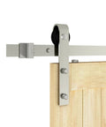 Close-up of 6 Ft Brushed Nickel Sliding Barn Door Hardware Kit With Smooth Quiet Hanger Rollers installed on wooden door