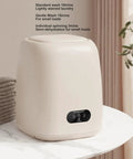 Game Changing 9L Portable Washing Machine With Spin Dryer And Clever Hidden Drain Hose on a marble table, compact and modern design.