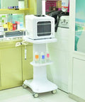 Solid Two Tier Rolling Utility Cart With Smooth Glide Casters For Beauty Salon Gear Heavy Duty Storage Trolley supporting a facial device and bottles.