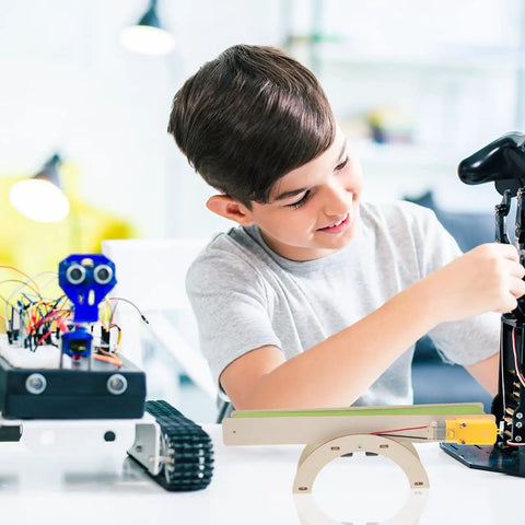 Child assembling DIY Electric Conveyor Belt Kit For Kids Hands On STEM Learning, 2 Piece Educational Model For Preschool And Classroom Use