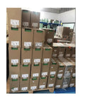 ATV610D37N4 PLC Module 380V 37KW Industrial Grade Controller With One Year Warranty boxes stacked in warehouse