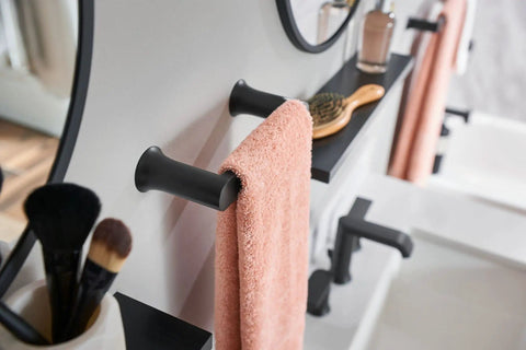 Genta LX Modern 6.8 Inch Matte Black Towel Bar for kitchen or bathroom with single bar design holding a towel, seen in close-up