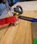DiaSharp Diamond Mini Hone Sharpening Kit used on scissors, includes red, blue, green 2.5-inch grit stones for edge restoration.