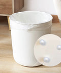 Close-up of 20 Piece Nylon Ball Transfer Bearing Set attached to a white round bin, showing omni directional roller bearings.