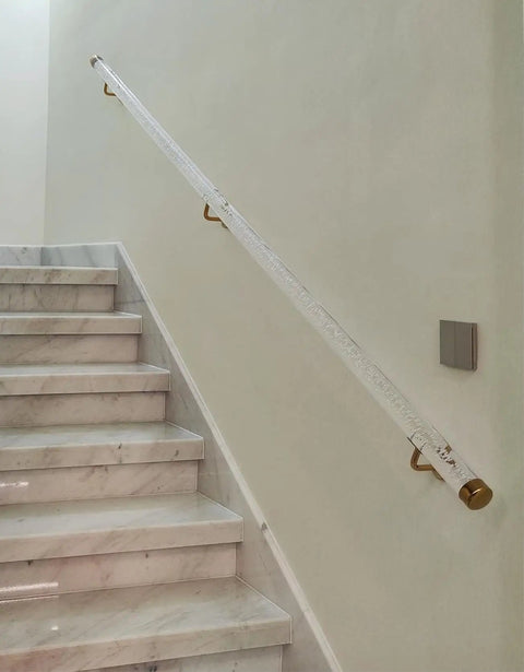 Slick Clear Acrylic Stair Handrail With Heavy Duty Gold Brackets on a marble staircase, offering secure grip for indoor steps.