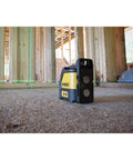 Cross Line Laser Level With Green Beam Pro Grade Durable Overmolded Housing 1 Meter Drop Rating Magnetic Bracket Full Time Pulse Mode Ideal For Picture Hanging And DIY Renovations in a construction site