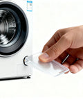 Person inserting Heavy Duty Clear Plastic Shims And Leveling Wedges For Wobbly Toilets Furniture And Appliances into a washer