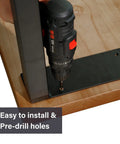 Person installing black industrial table leg with drill, part of 22 Inch Black Industrial Table Leg Set Of 2 Heavy Duty Steel Desk Bench And Coffee Table Legs With 600 To 800 Pounds Load Capacity Glossy Black Finish Ideal For DIY Tables Desks And Home Projects