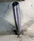 Strong-Bolt 2 Wedge Anchor 1/2 In X 5-1/2 In installed in concrete, showing chamfered top. Suitable for static and seismic loads.