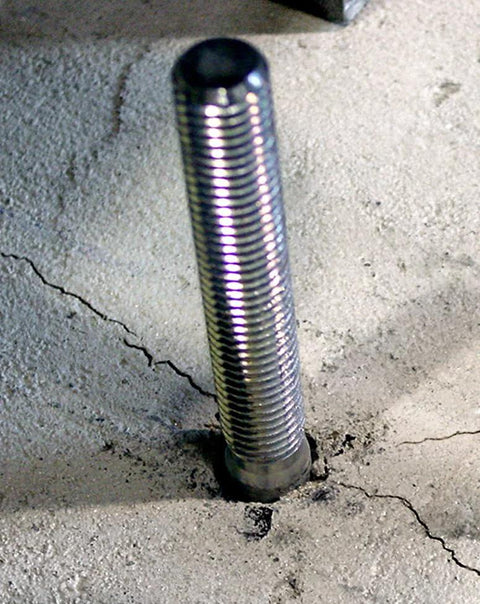 Strong-Bolt 2 Wedge Anchor 1/2 In X 5-1/2 In installed in concrete, showing chamfered top. Suitable for static and seismic loads.