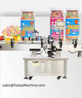 Built Tough Automatic Labeling Machine For Round Bottles And Vials Delivers Dead On Accuracy to label candy jars on a production line.