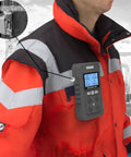 4 Gas Portable Monitor With Rechargeable Battery And LCD Display Detects H2S O2 CO And LEL attached to worker's jacket