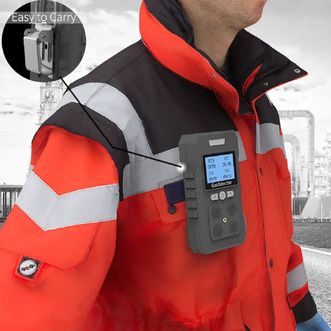 4 Gas Portable Monitor With Rechargeable Battery And LCD Display Detects H2S O2 CO And LEL attached to worker's jacket