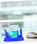 Sky-blue Pendulum Demonstration Tool For Newtonian Mechanics Easy To Use Physics Lab Gear on a lab desk with beakers