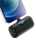 Nifty 5000mAh PD Fast Charging Power Bank For iPhone 14 And 13 Series slim battery pack charging smartphone with LED display.