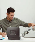 Man using cash counter next to Beefy Locking Cash Box With Money Tray For Cash Registers, Metal Safe Box, Black