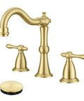 Brushed gold bathroom faucet with dual handles and matching pop-up drain for a modern vanity