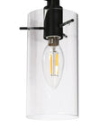 Close-up of 3-Light Gold Vanity Light With Seeded Glass Shades For Bathroom Over Mirror, detail of bulb and clear shade