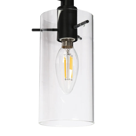 Close-up of 3-Light Gold Vanity Light With Seeded Glass Shades For Bathroom Over Mirror, detail of bulb and clear shade