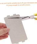 Person cutting Microwave Waveguide Mica Sheets 12 Pack Heat Resistant Insulation Pads And Replacement Plate for Cooking And Baking.
