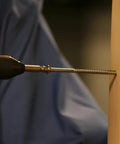 Pro Grabit 8430P Two Step Drill Bit And Screw Extractor Kit being used on a wooden surface, showing precise drilling.