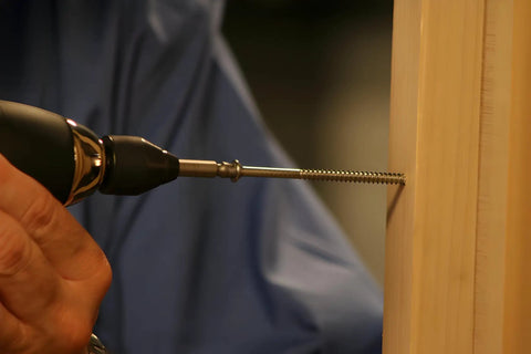 Pro Grabit 8430P Two Step Drill Bit And Screw Extractor Kit being used on a wooden surface, showing precise drilling.