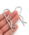 Close-up view of two stainless steel R clips from 4 Pieces R Clips Hitch Pins Set In Stainless Steel For Trailers And Tow Bars.