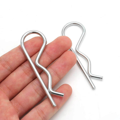 Close-up view of two stainless steel R clips from 4 Pieces R Clips Hitch Pins Set In Stainless Steel For Trailers And Tow Bars.