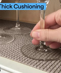 Pro Level Non Adhesive Cabinet Liner For Drawers And Shelves, Extra Grip Anti Slip Paper In Smooth Beige on shelf with glasses.