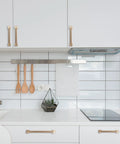 Modern kitchen with Champagne Bronze Cabinet Handles Set of 10, 5 Inch (128mm) Drawer Pulls installed on white cabinets.