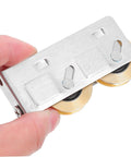 Get Your Track Setup Running Like Butter With These Heavy Duty Sliding Door And Window Pulleys Crafted From Premium Stainless Steel And Fitted With Dual Copper Wheels For Effortless Everyday Glide, hand-held silver pulley with dual copper wheels.