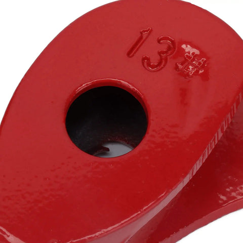 Close-up of a red heavy duty manual pipe bender eyelet, showing hole for conduit, made from heat treated carbon steel.