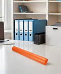 Telescopic Poster Tube Holder 52 To 95 Cm Expandable Mailing Tube on a desk with office supplies in the background