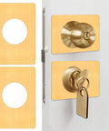 Two Pack Stainless Steel Door Lock Reinforcement Plates With Adhesive Tape Gold Finish shown on a door key inserted