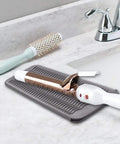 Heat Resistant Hair Tools Mat And Pouch Silicone Heat Mat And Holder For Curling Irons And Flat Irons on countertop with tools