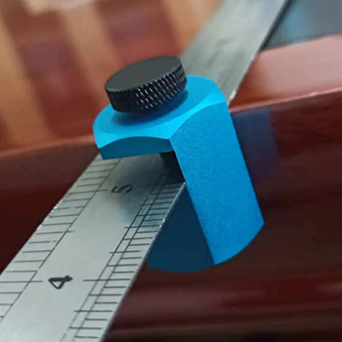 Close-up of Heavy Duty Aluminum Framing Square Jig Quick Set Rafter Layout Guide attachment on ruler for precision woodworking.