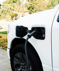 Car exterior showcasing Beefy Level 2 EV Charger With 48 Amp Output And Up To Eleven Kilowatts Fast Wall Charging For Home Or Outdoor Use
