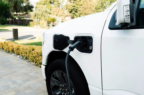 Car exterior showcasing Beefy Level 2 EV Charger With 48 Amp Output And Up To Eleven Kilowatts Fast Wall Charging For Home Or Outdoor Use