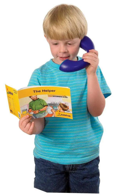 Child using Phoneme Phone Reading Tool for Kids With Speech Therapy Fun Hands On Playset for Phonemic Awareness while reading a book.