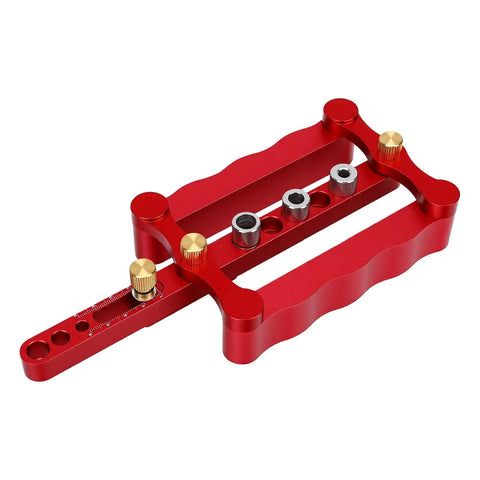 Self Centering Doweling Jig Kit With Premium Steel Bushings For Dead On Woodworking Alignments And Zero Sweat Setup in red aluminum.