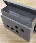 Panel Enclosure 351595 With Button Holes for Control Panels, steel box with mounting bosses and cable pass-through, open view.