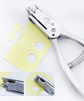 Hand Held Slot And Thirteen Millimeter Round Hole Punch Tool 2-In-1 Diy Puncher showing holes in yellow card stock