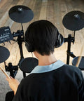 Person playing DTX-PRO Electronic Drum Trigger Module With 70 Premium Customizable Kits in studio setup