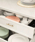Open drawer with Champagne Bronze Stainless Steel Cabinet Handle, showing plates and cups